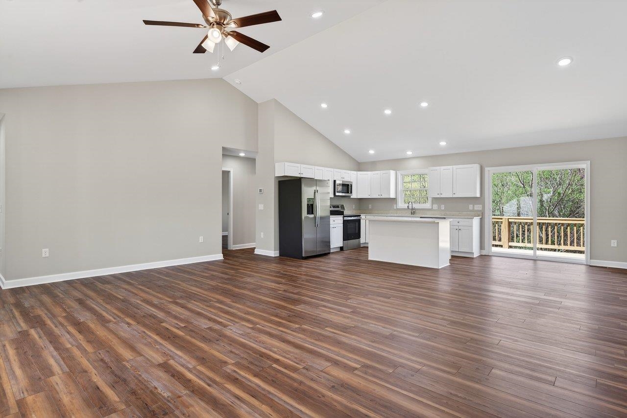 254 Locustdale Loop Shenandoah, VA 22849 - Photo 16 of 58 a view of an empty room with a window and wooden floor