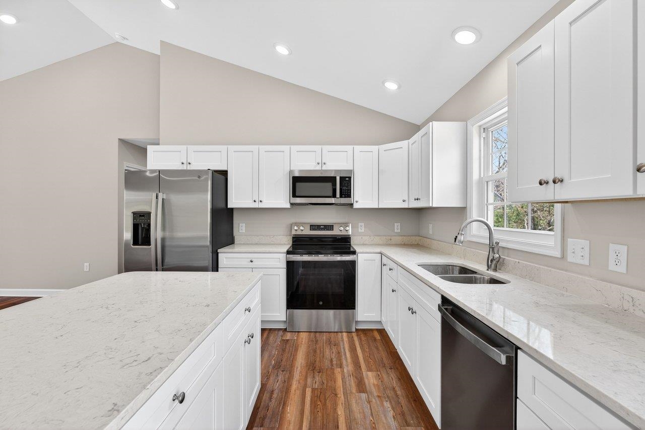 254 Locustdale Loop Shenandoah, VA 22849 - Photo 20 of 58 a kitchen with a sink a stove and refrigerator