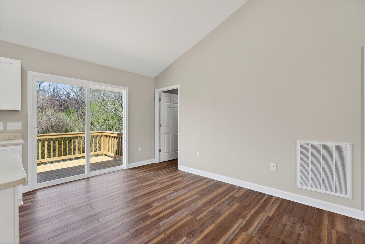 254 Locustdale Loop Shenandoah, VA 22849 - Photo 23 of 58 a view of wooden floor and windows in a room