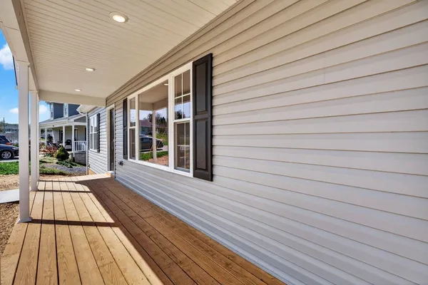 a view of a balcony with wooden floor
