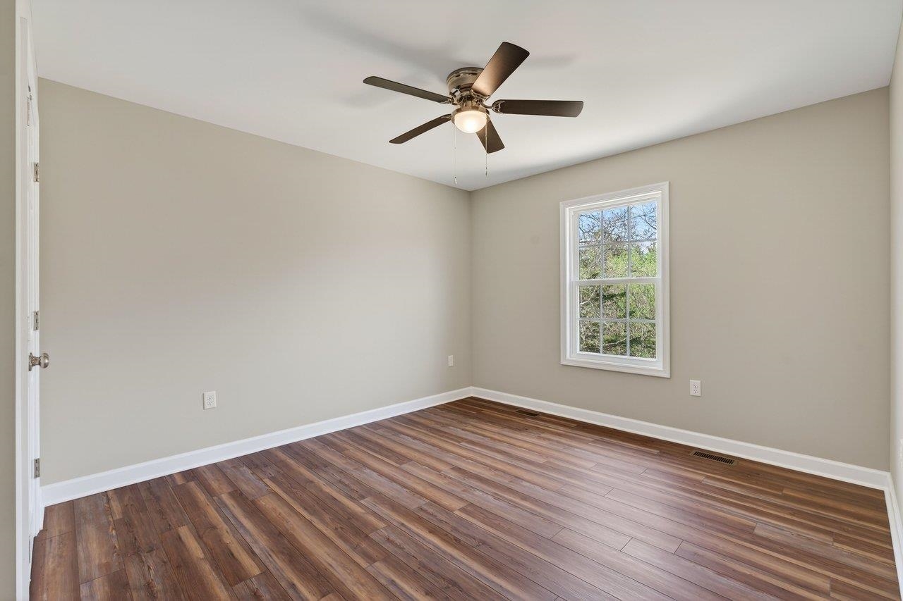 254 Locustdale Loop Shenandoah, VA 22849 - Photo 38 of 58 an empty room with wooden floor and windows
