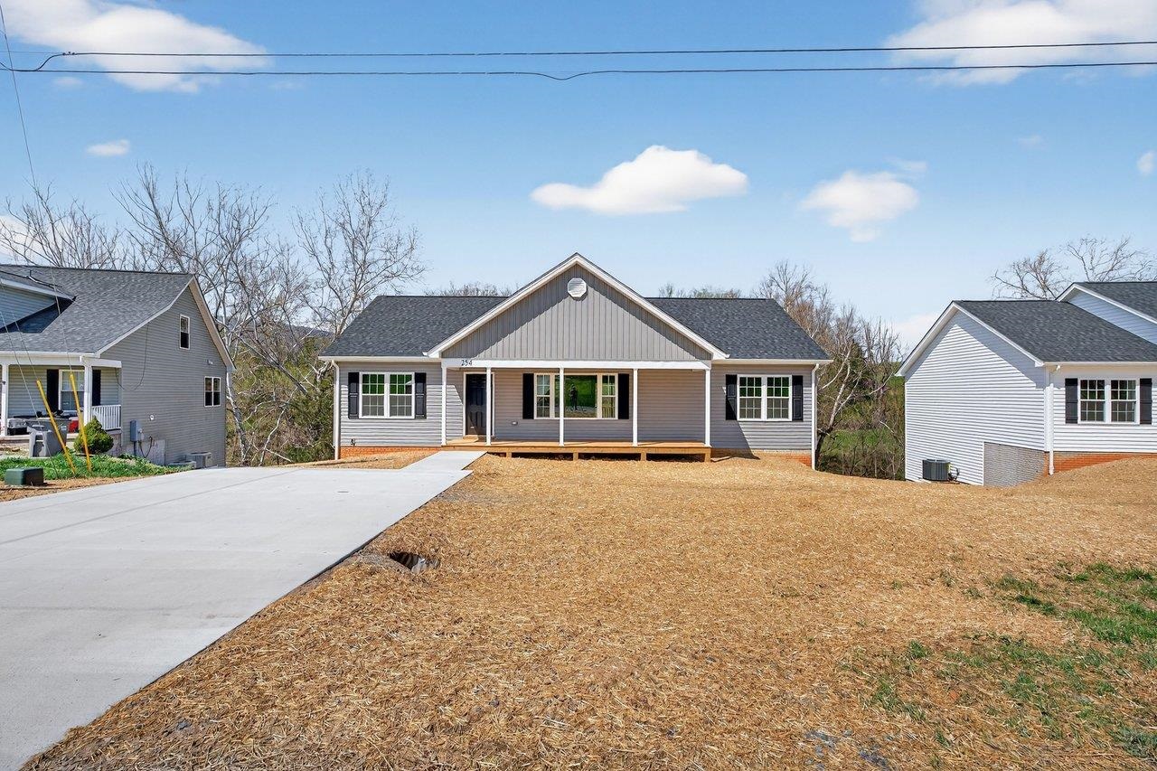 254 Locustdale Loop Shenandoah, VA 22849 - Photo 49 of 58 a front view of house with yard and trees in the background