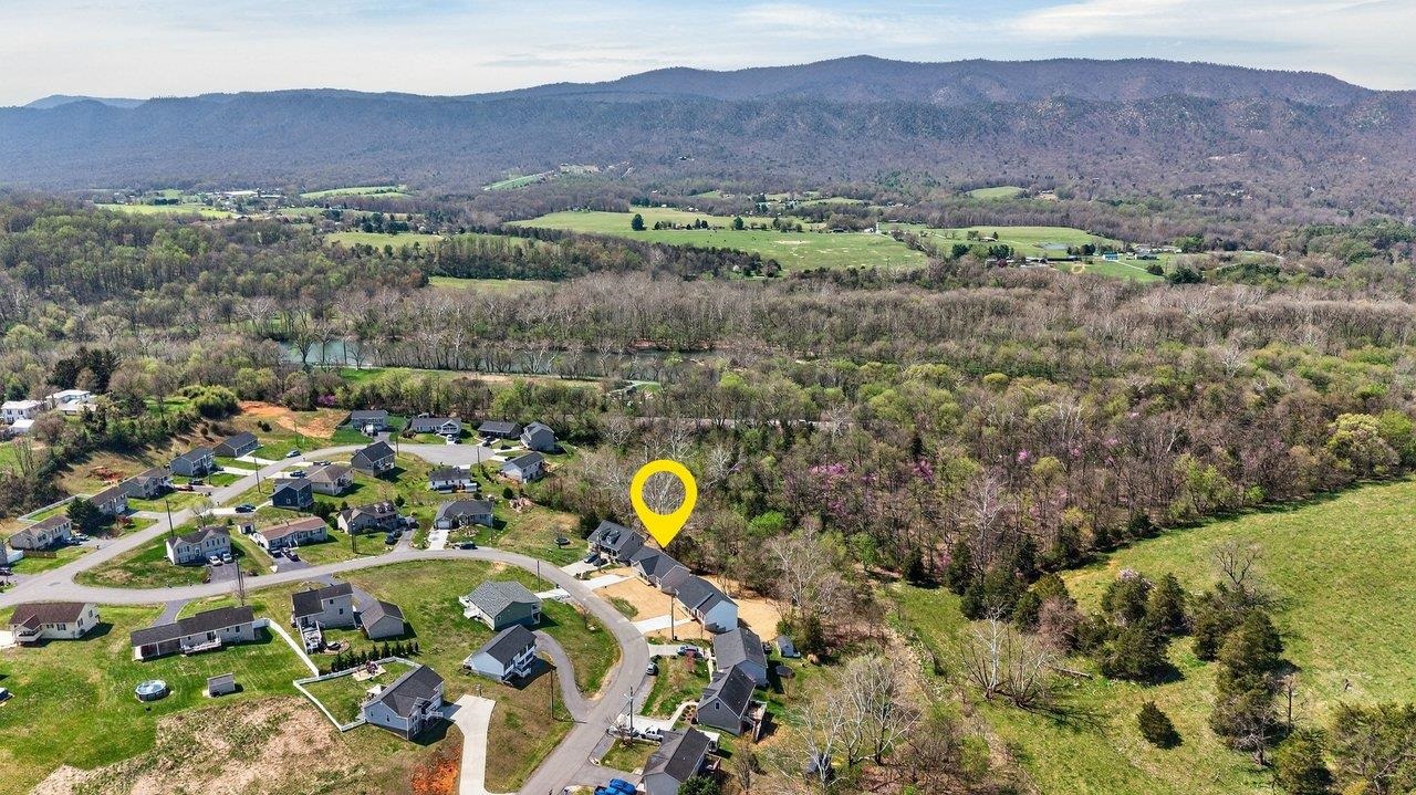 254 Locustdale Loop Shenandoah, VA 22849 - Photo 57 of 58 a view of a lush green hillside and a houses