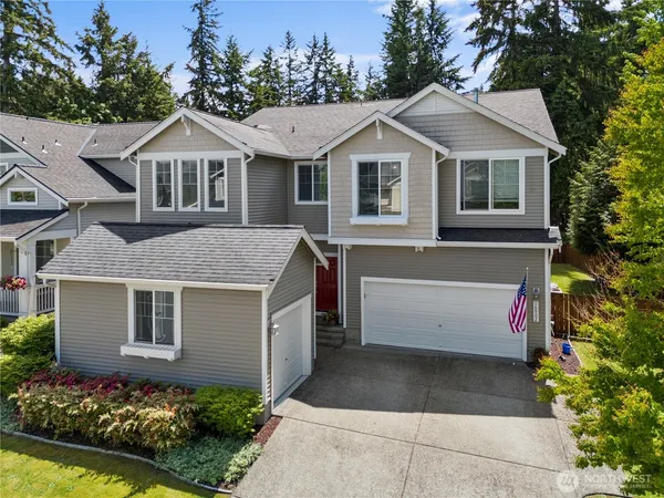 a front view of a house with a garage