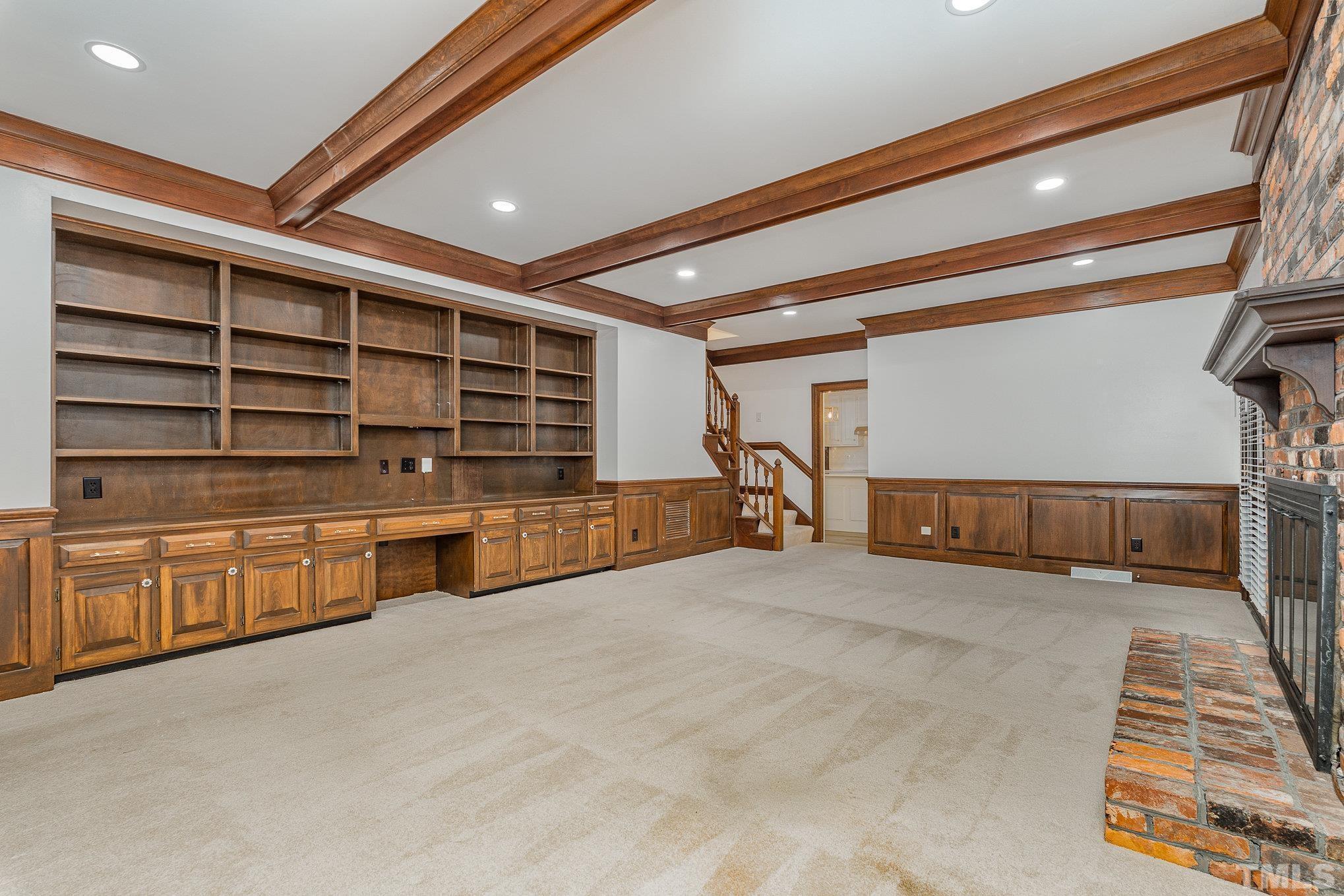5101 Holly Ridge Farm Road Raleigh, NC 27616 - Photo 10 of 26 a view of an empty room with cabinet and stairs