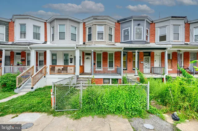 front view of a building with a garden