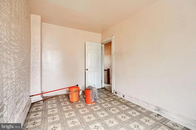a view of a bedroom with a sink and closet