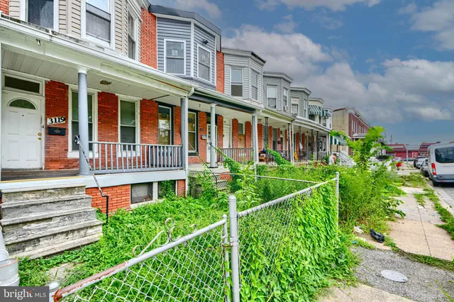 front view of a building with a yard