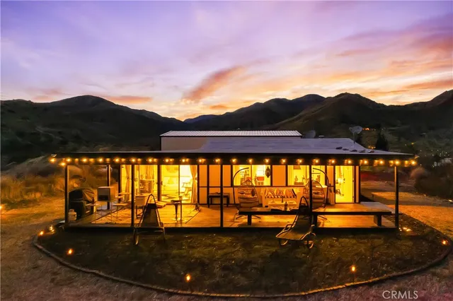 a view of a house with a yard from a balcony