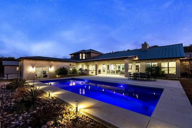 a view of a yard with table and chairs