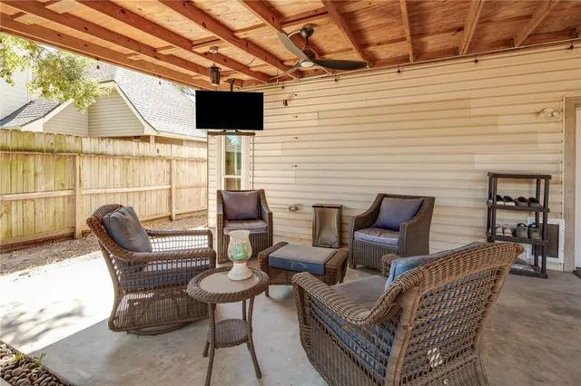 a view of a patio with table and chairs