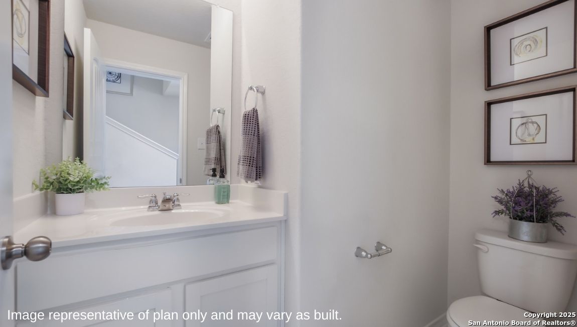 624 Fluted Shoals Cibolo, TX 78108 - Photo 20 of 38 a bathroom with a sink a toilet and mirror