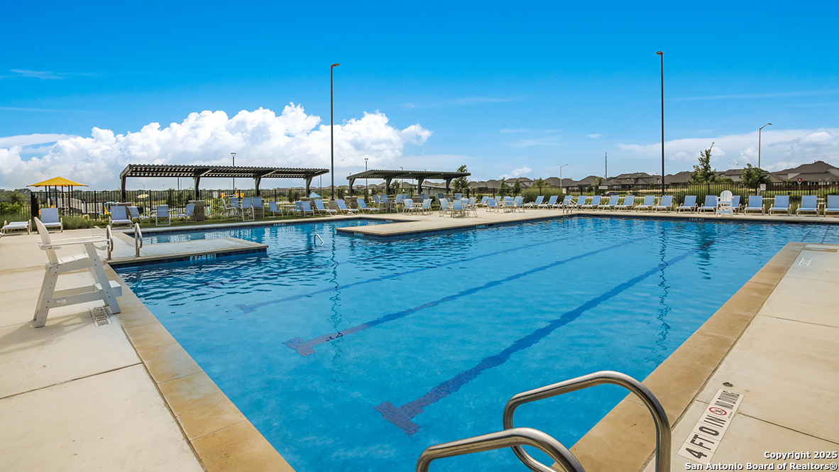 624 Fluted Shoals Cibolo, TX 78108 - Photo 34 of 38 a view of a swimming pool with a chairs