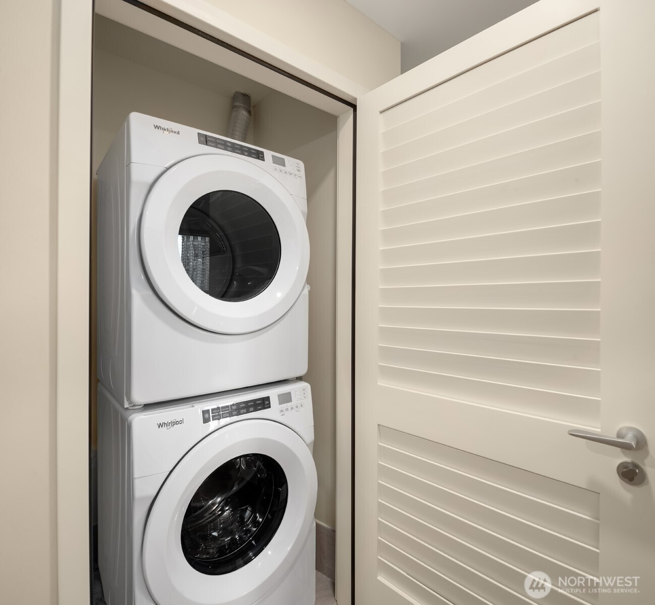 121 Stewart Street, Unit 1602 Seattle, WA 98101 - Photo 15 of 27 a utility room with dryer and washer