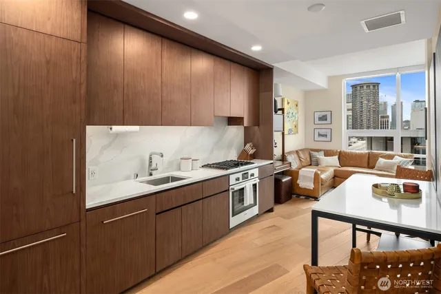 a kitchen with a sink cabinets and window