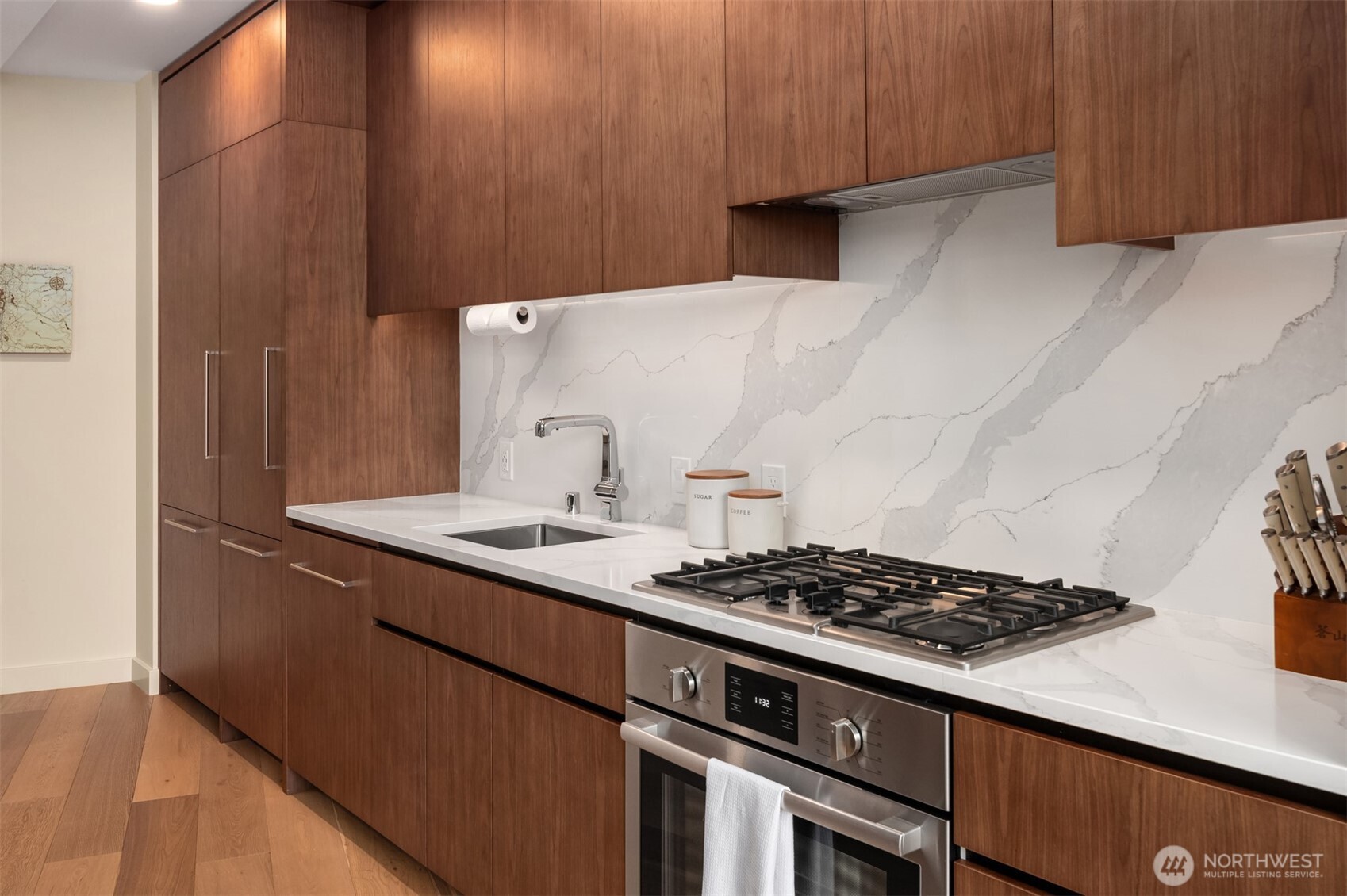 121 Stewart Street, Unit 1602 Seattle, WA 98101 - Photo 9 of 27 a kitchen with a stove and a refrigerator