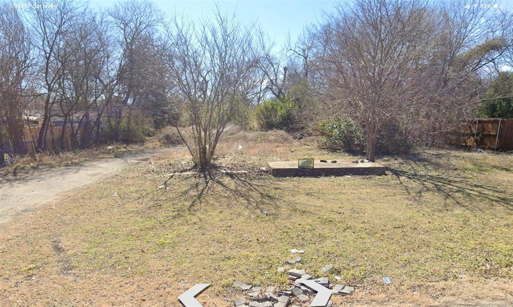 124 East 6th Street Lancaster, TX 75146 - Photo 1 of 4 a view of a yard with trees