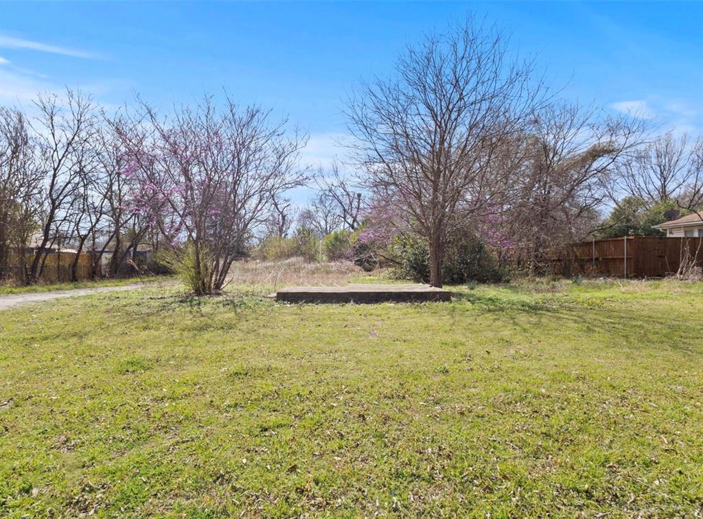 124 East 6th Street Lancaster, TX 75146 - Photo 3 of 6 a view of a yard with a house