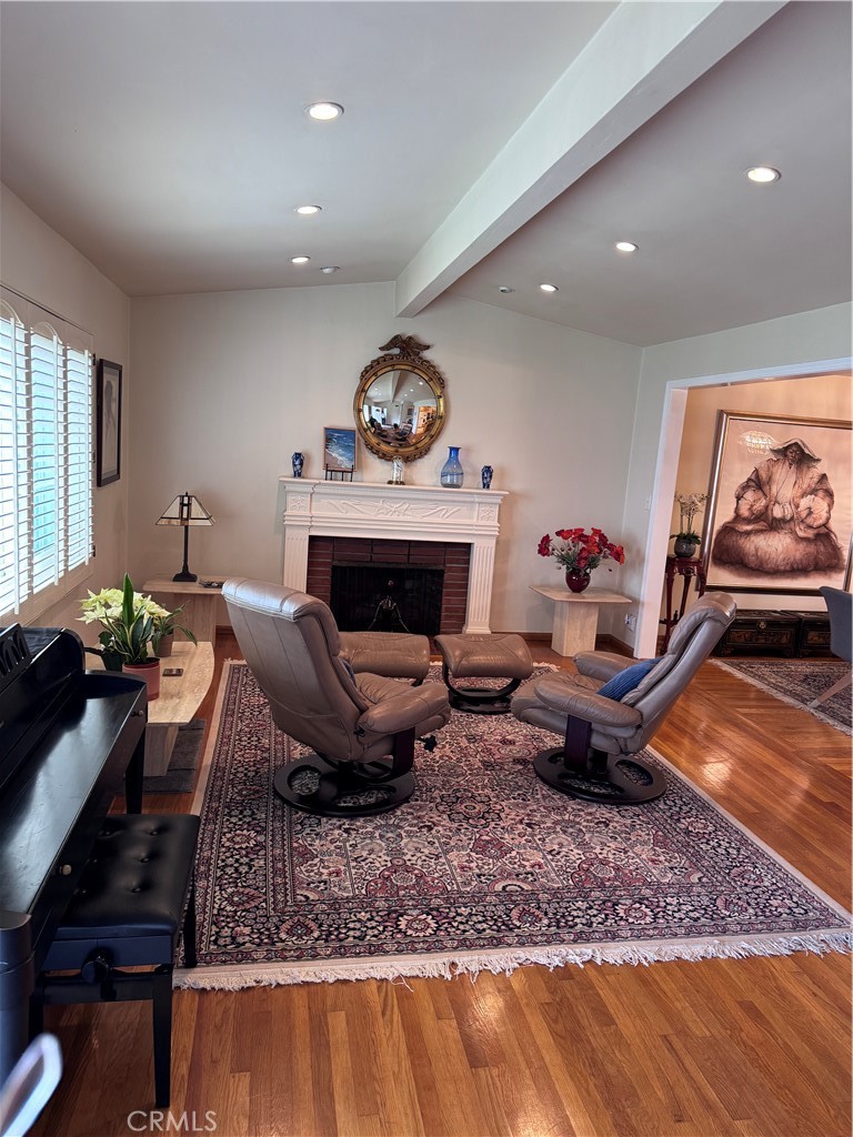 1401 Hackett Avenue Long Beach, CA 90815 - Photo 11 of 48 a living room with furniture and a fireplace
