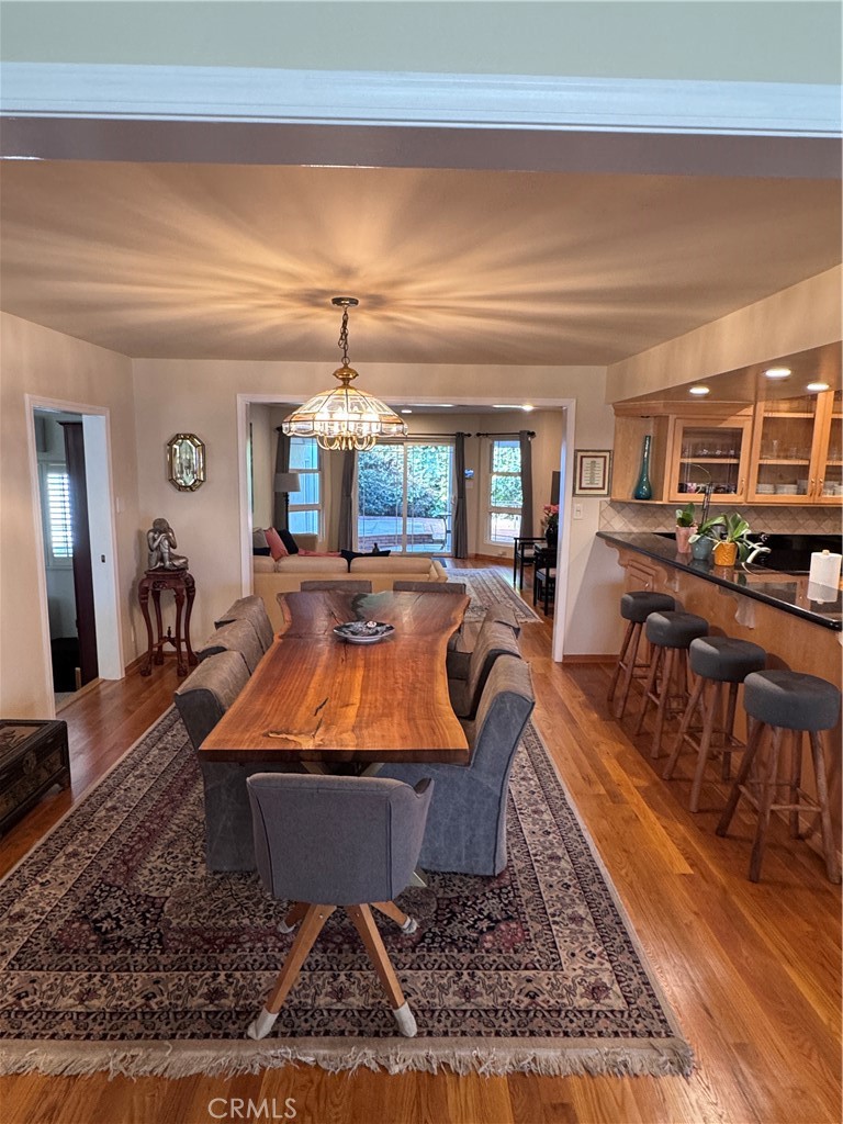 1401 Hackett Avenue Long Beach, CA 90815 - Photo 14 of 48 a living room with furniture a rug and a dining table