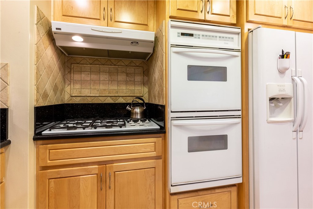 1401 Hackett Avenue Long Beach, CA 90815 - Photo 21 of 48 a stove top oven sitting inside of a kitchen