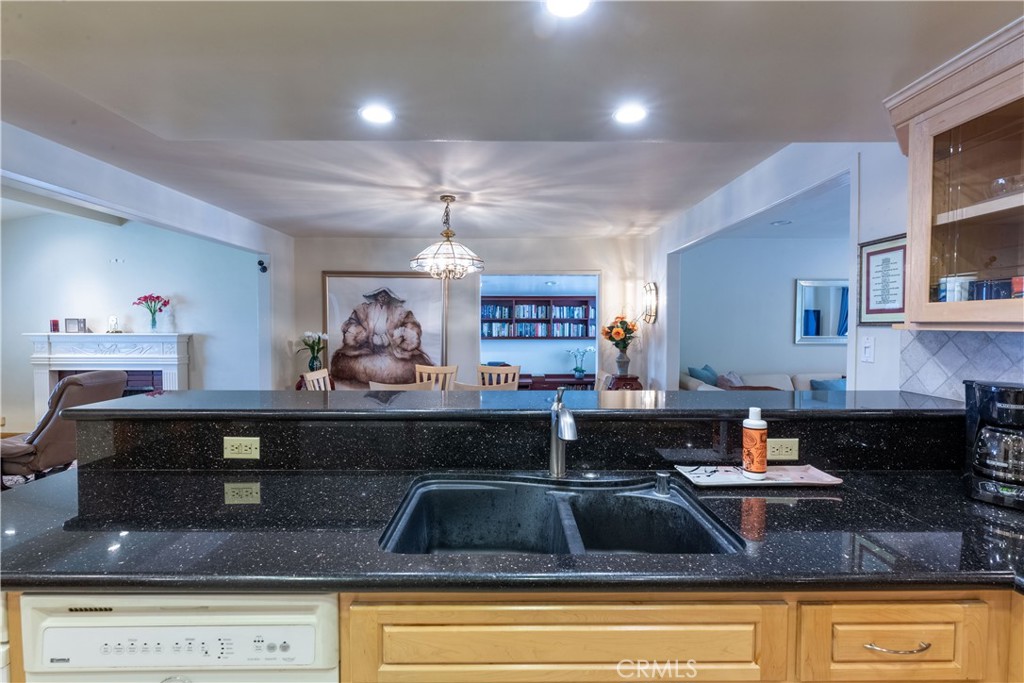 1401 Hackett Avenue Long Beach, CA 90815 - Photo 22 of 48 a kitchen with a sink and chandelier
