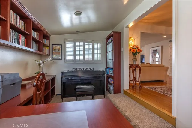 a view of a livingroom with furniture and staircase
