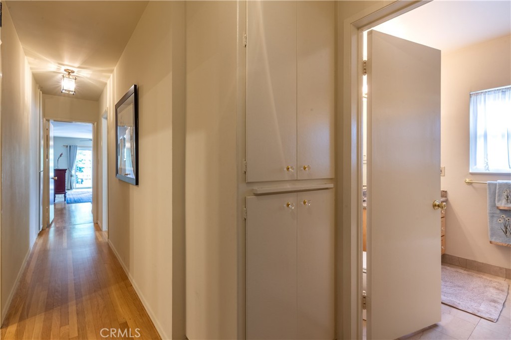 1401 Hackett Avenue Long Beach, CA 90815 - Photo 31 of 48 a view of a hallway with wooden floor and a bathroom