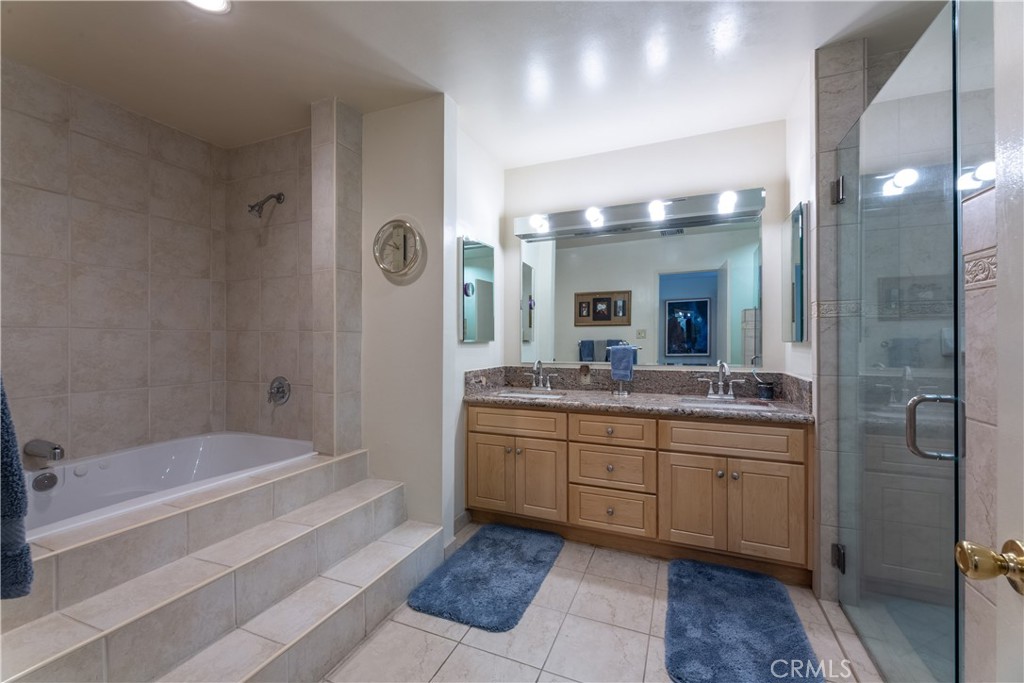1401 Hackett Avenue Long Beach, CA 90815 - Photo 38 of 48 a bathroom with a granite countertop sink mirror and a bathtub