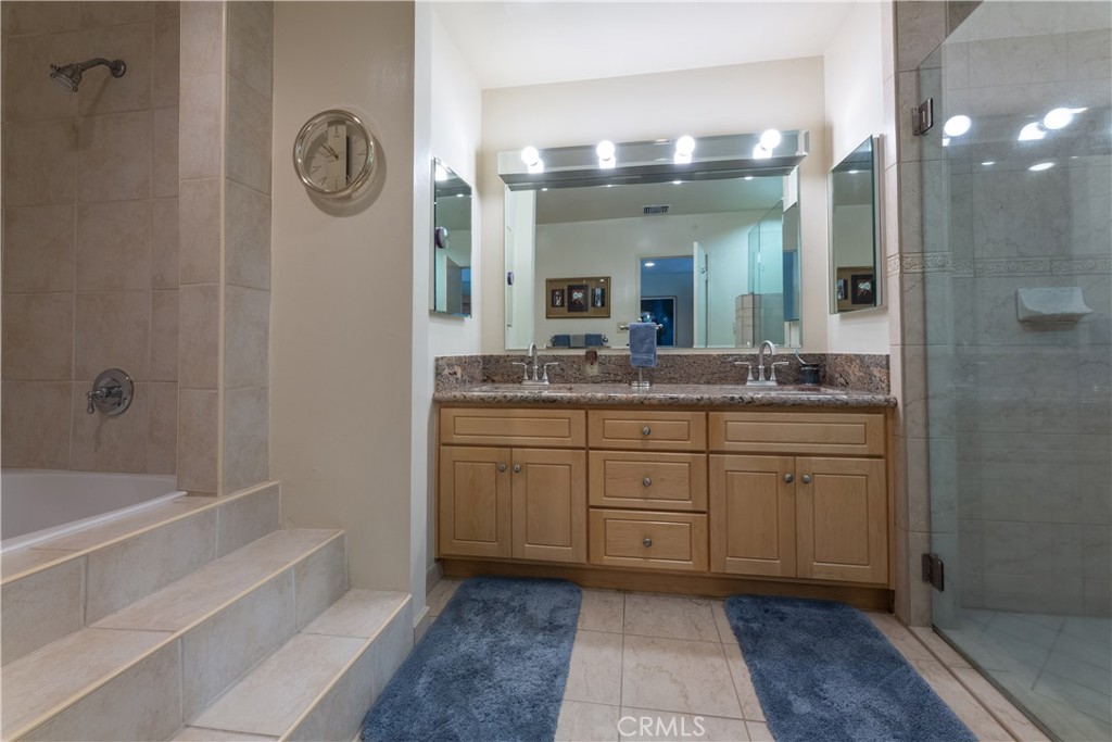 1401 Hackett Avenue Long Beach, CA 90815 - Photo 41 of 48 a bathroom with a granite countertop sink mirror and a toilet
