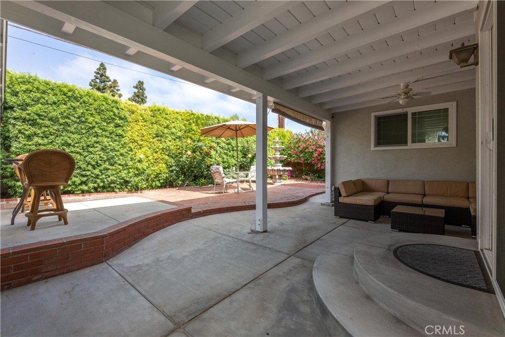 1401 Hackett Avenue Long Beach, CA 90815 - Photo 42 of 48 a living room with patio furniture and a floor to ceiling window