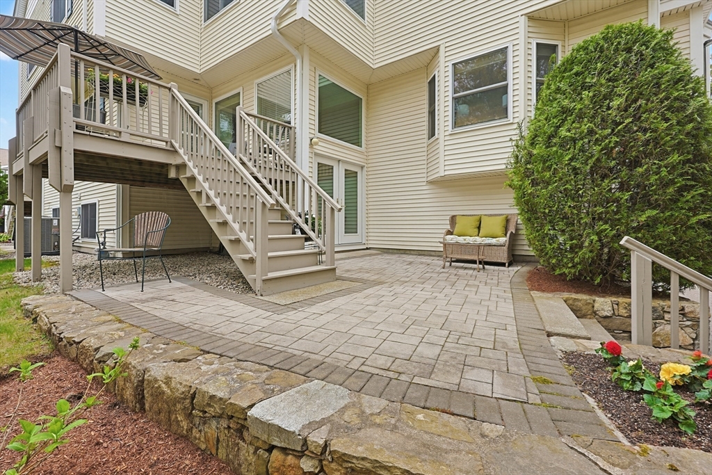 3002 Maple Brook Road, Unit 3002 Bellingham, MA 02019 - Photo 3 of 42 a view of a building with many windows