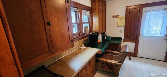 a kitchen with a refrigerator and a stove