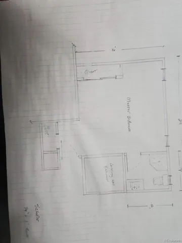 a kitchen with a dining table cabinets appliances and a window