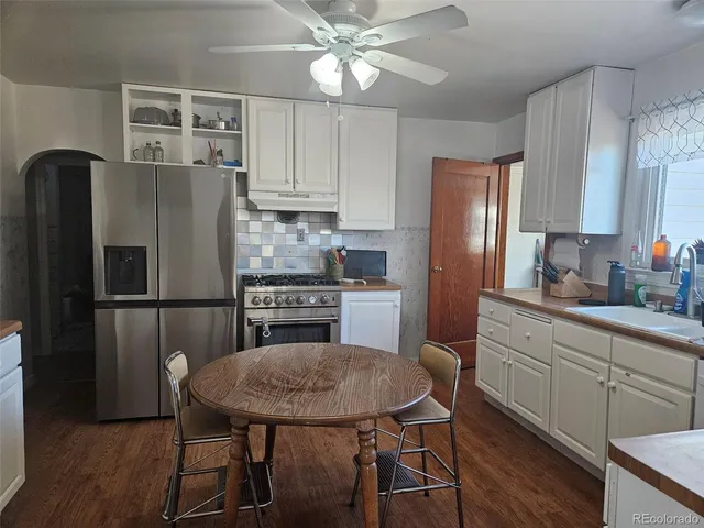 a white toilet sitting next to a window