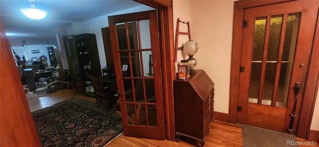 a bedroom with a bed and a mirror