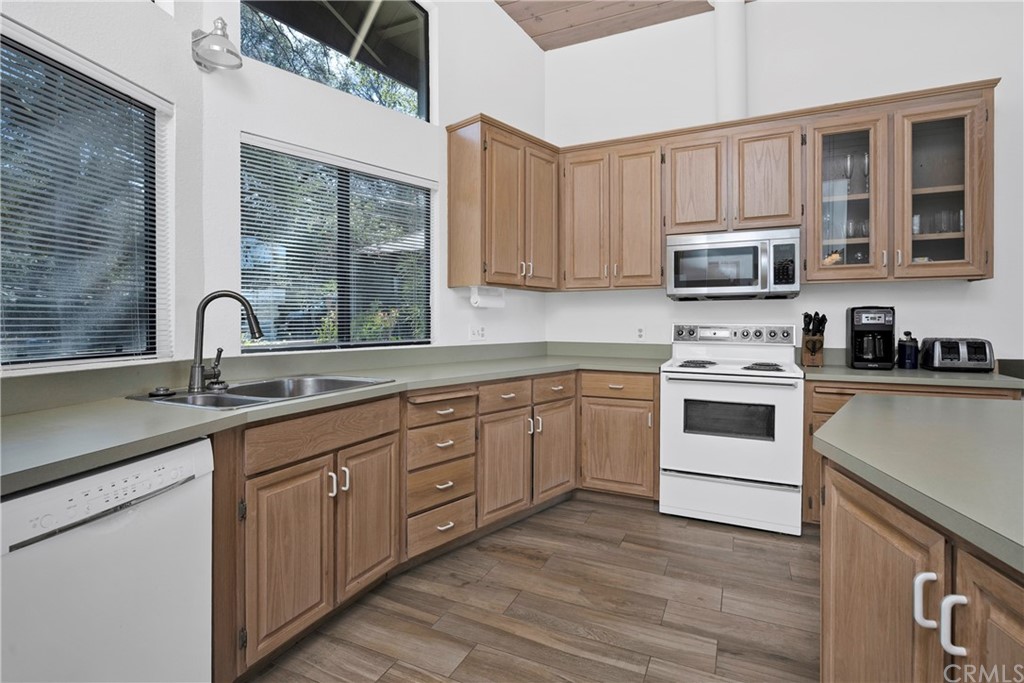 5191 Lake Boulevard Lower Lake, CA 95457 - Photo 12 of 44 a kitchen with cabinets stainless steel appliances a sink and a window