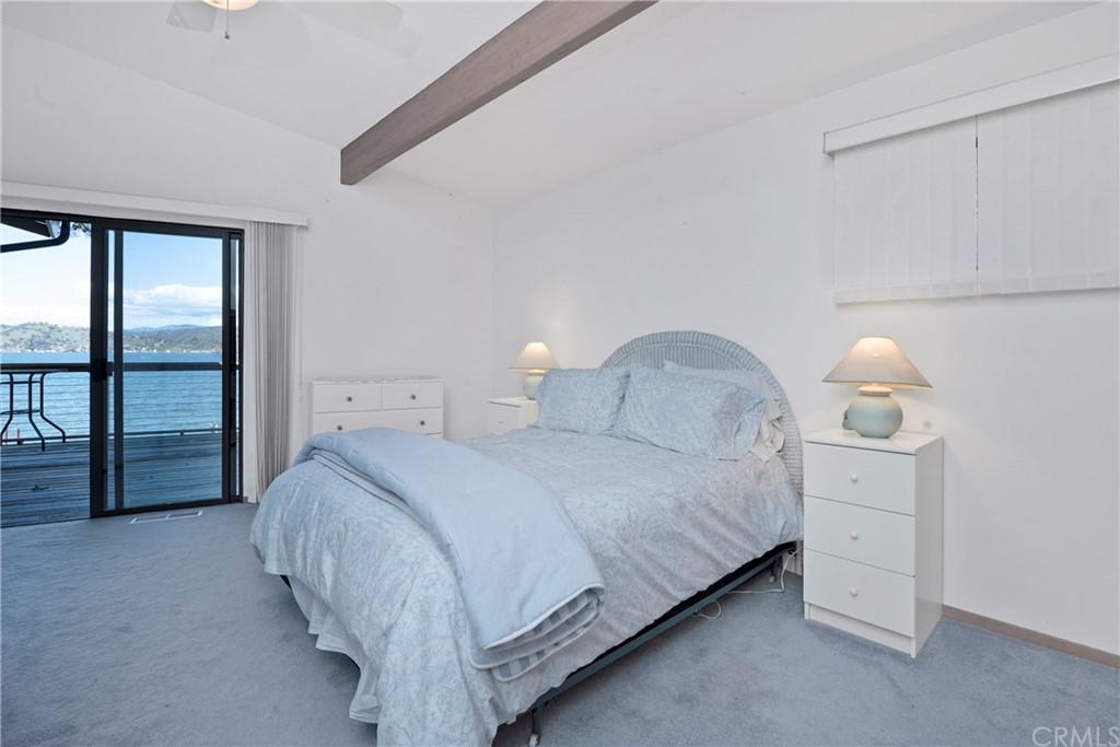 5191 Lake Boulevard Lower Lake, CA 95457 - Photo 14 of 44 a bedroom with a bed and a night stand