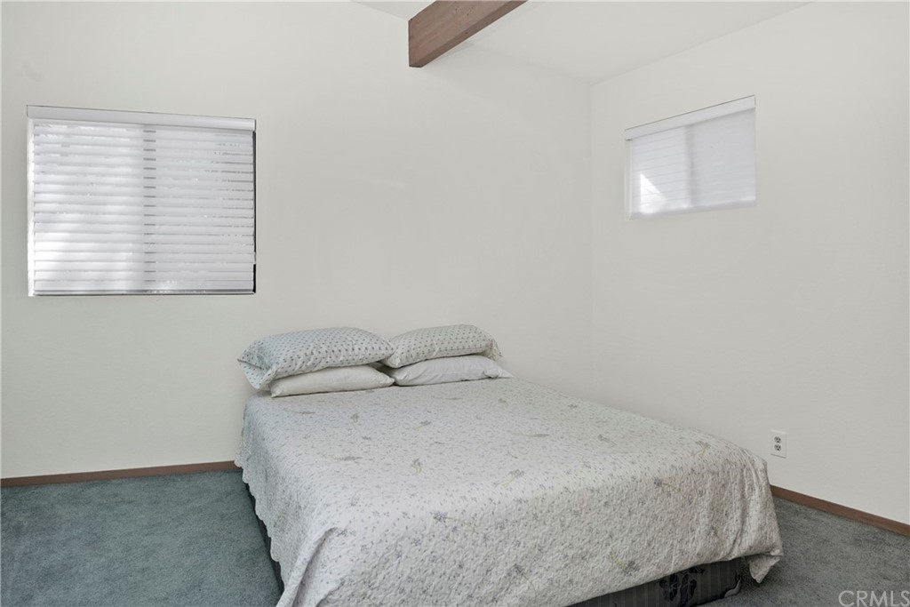 5191 Lake Boulevard Lower Lake, CA 95457 - Photo 17 of 44 a bedroom with a bed and a window