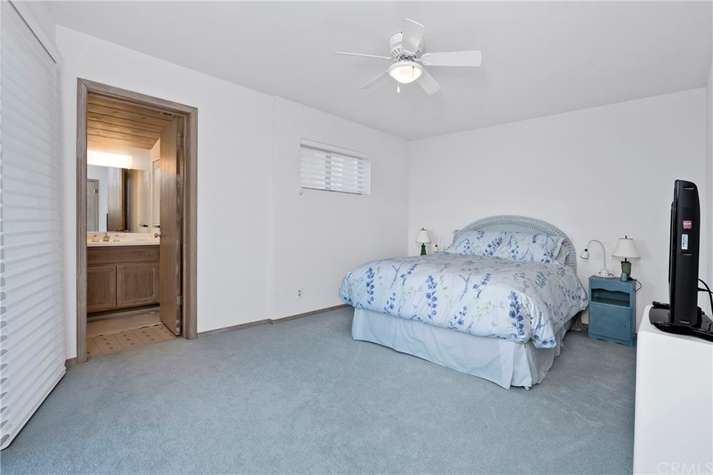 5191 Lake Boulevard Lower Lake, CA 95457 - Photo 20 of 44 a bedroom with a bed and a chandelier