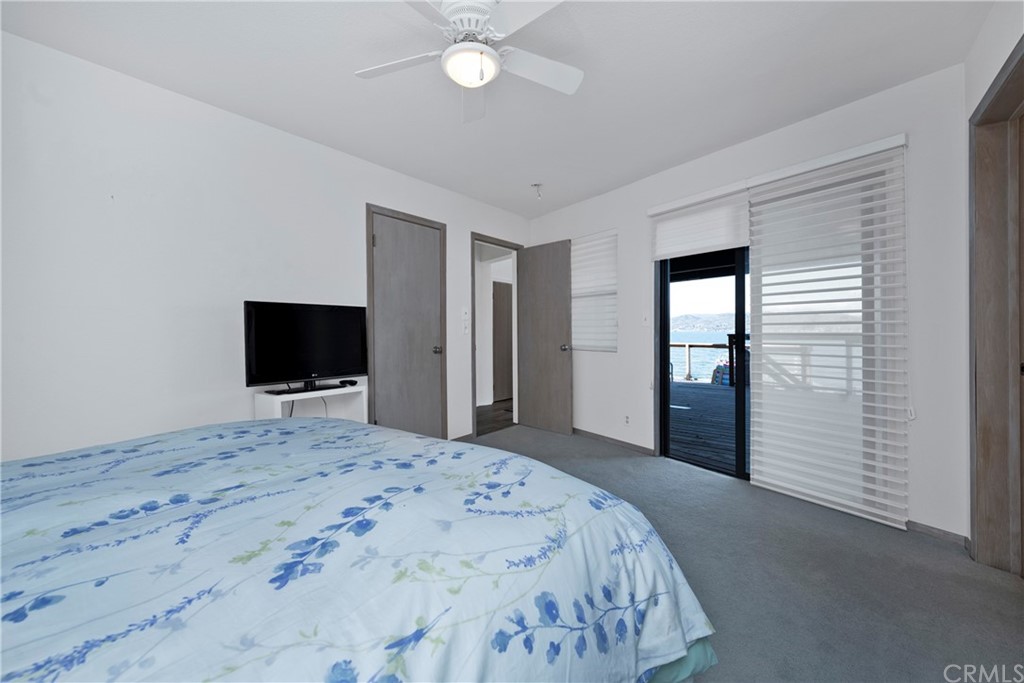 5191 Lake Boulevard Lower Lake, CA 95457 - Photo 22 of 44 a bedroom with a bed and a flat screen tv