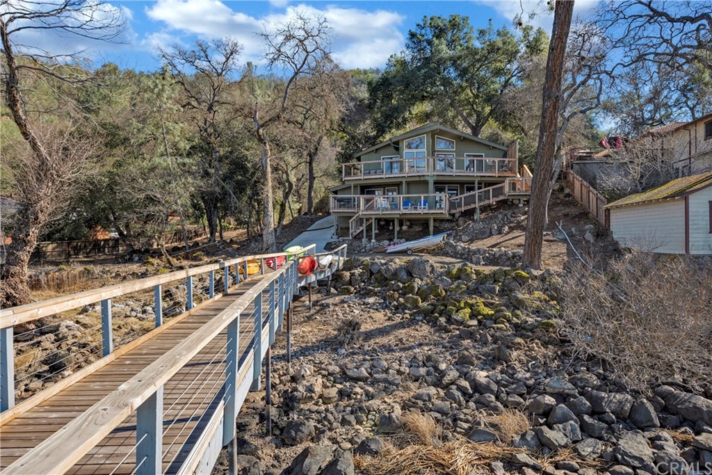 5191 Lake Boulevard Lower Lake, CA 95457 - Photo 34 of 44 a view of a house with large trees next to a road