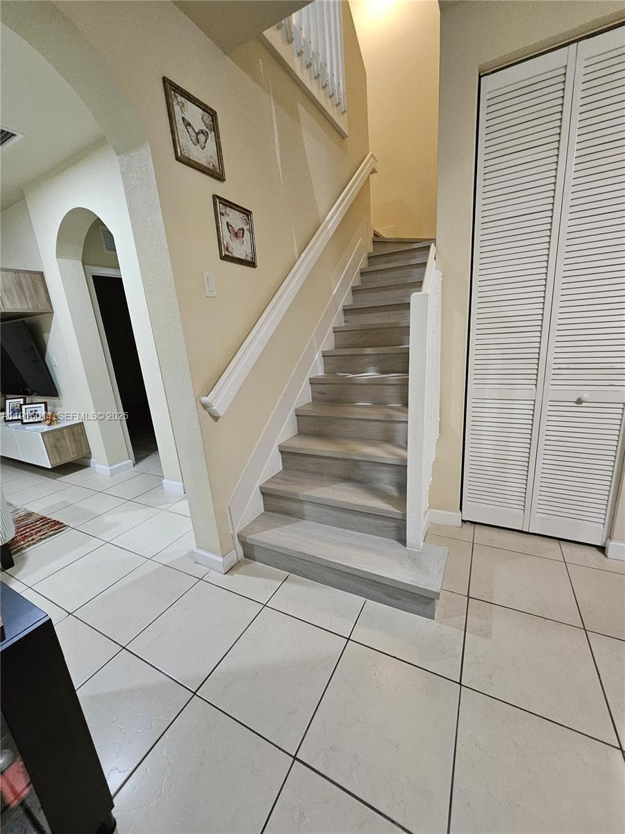 9572 Southwest 169th Place Miami, FL 33196 - Photo 7 of 14 a view of entryway with workspace and stairs
