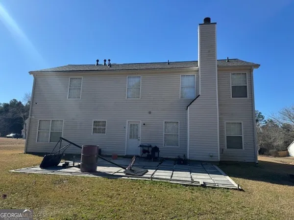 a view of a house with large windows