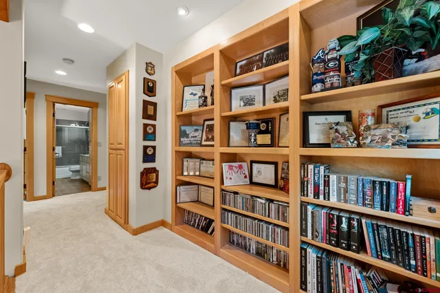 a view of room with furniture book shelf and book shelf