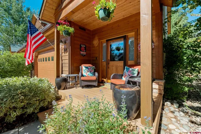 a outdoor space with patio furniture and potted plants