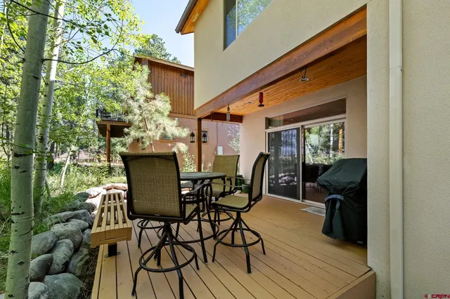 a view of a chairs and table in the patio