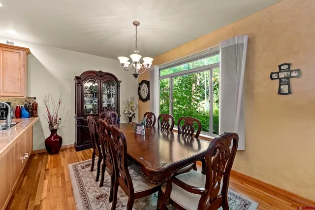 a view of a dining room with furniture window and outside view