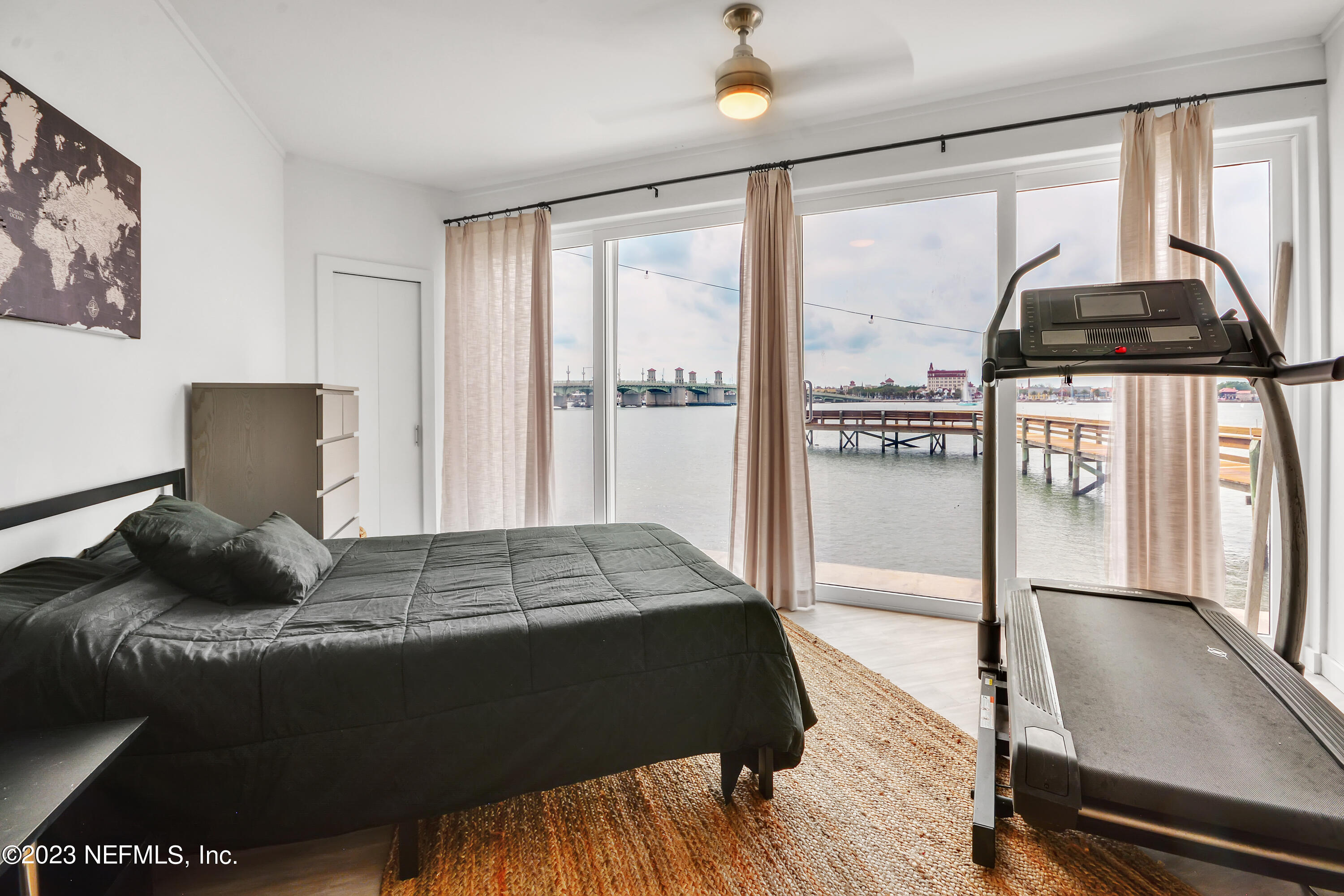 18 North St Augustine Boulevard, Unit 11 St. Augustine, FL 32080 - Photo 17 of 37 a bedroom with a bed and wooden floor