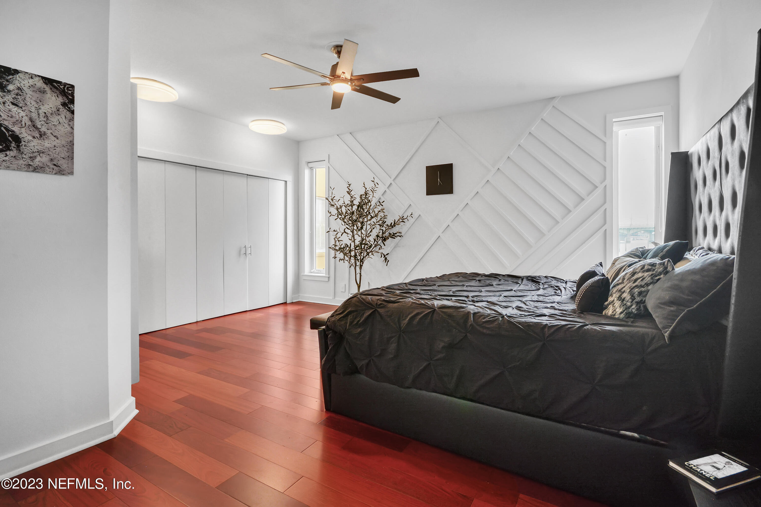 18 North St Augustine Boulevard, Unit 11 St. Augustine, FL 32080 - Photo 19 of 37 a bedroom with a bed and a ceiling fan